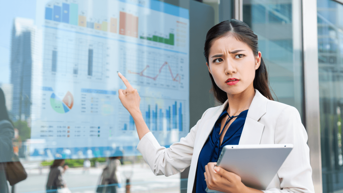 A marketers behind a computer grades her business
